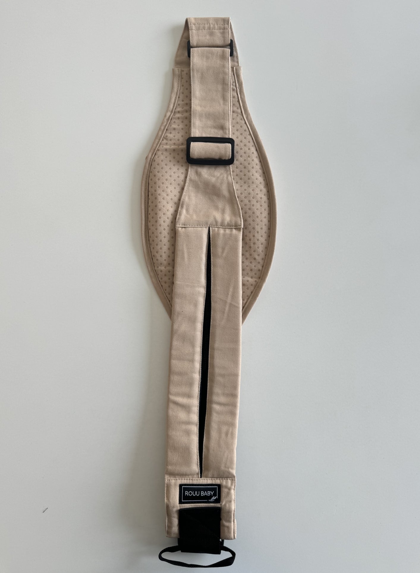 Back view of the Sand Beige Rouu Baby II carrier showing the extendable back strap