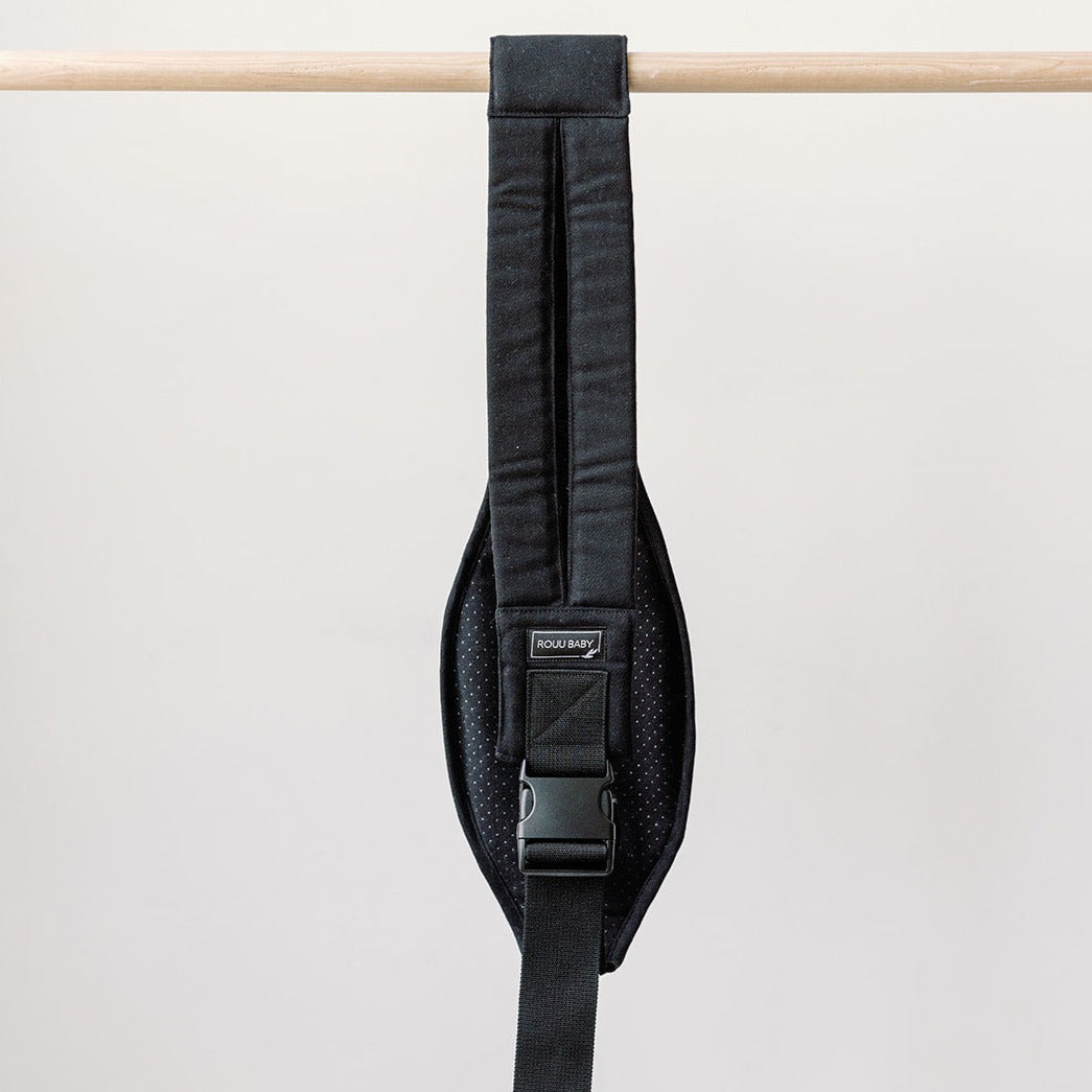 Jet Black Rouu Baby II hip carrier worn on the hip, side view