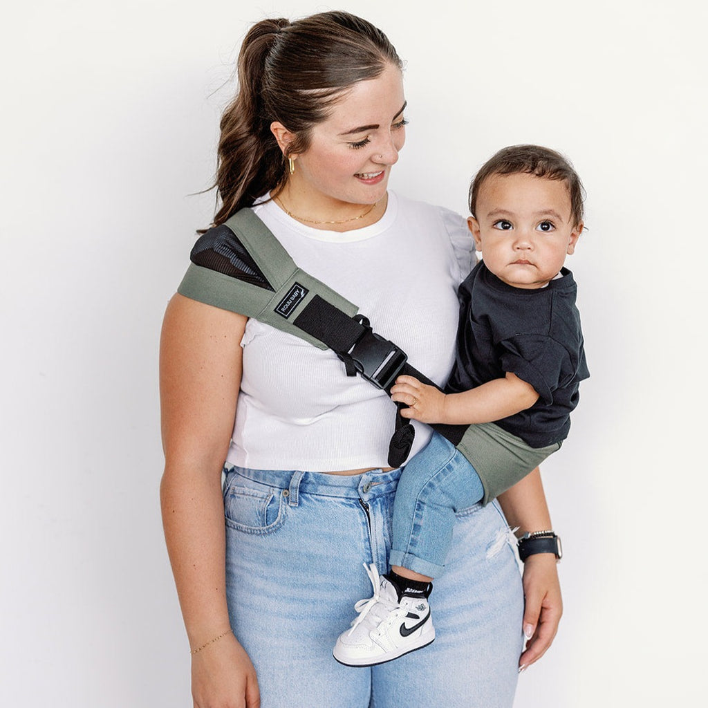 Parent and child outdoors with the Olive Rouu Baby II hip carrier